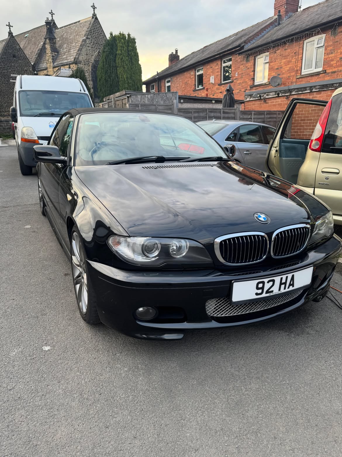 Black BMW E46 convertible with a mirror finish after stage 2 machine polishing
