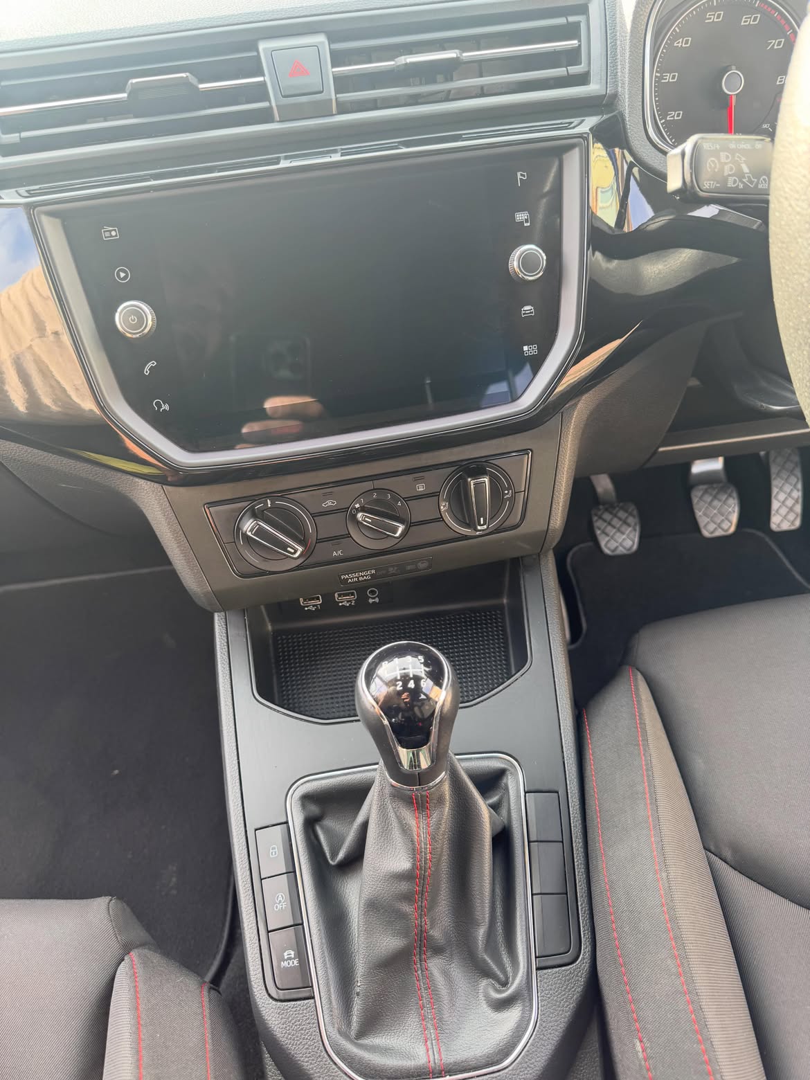 The same dashboard and infotainment screen after cleaning, clear and dressed