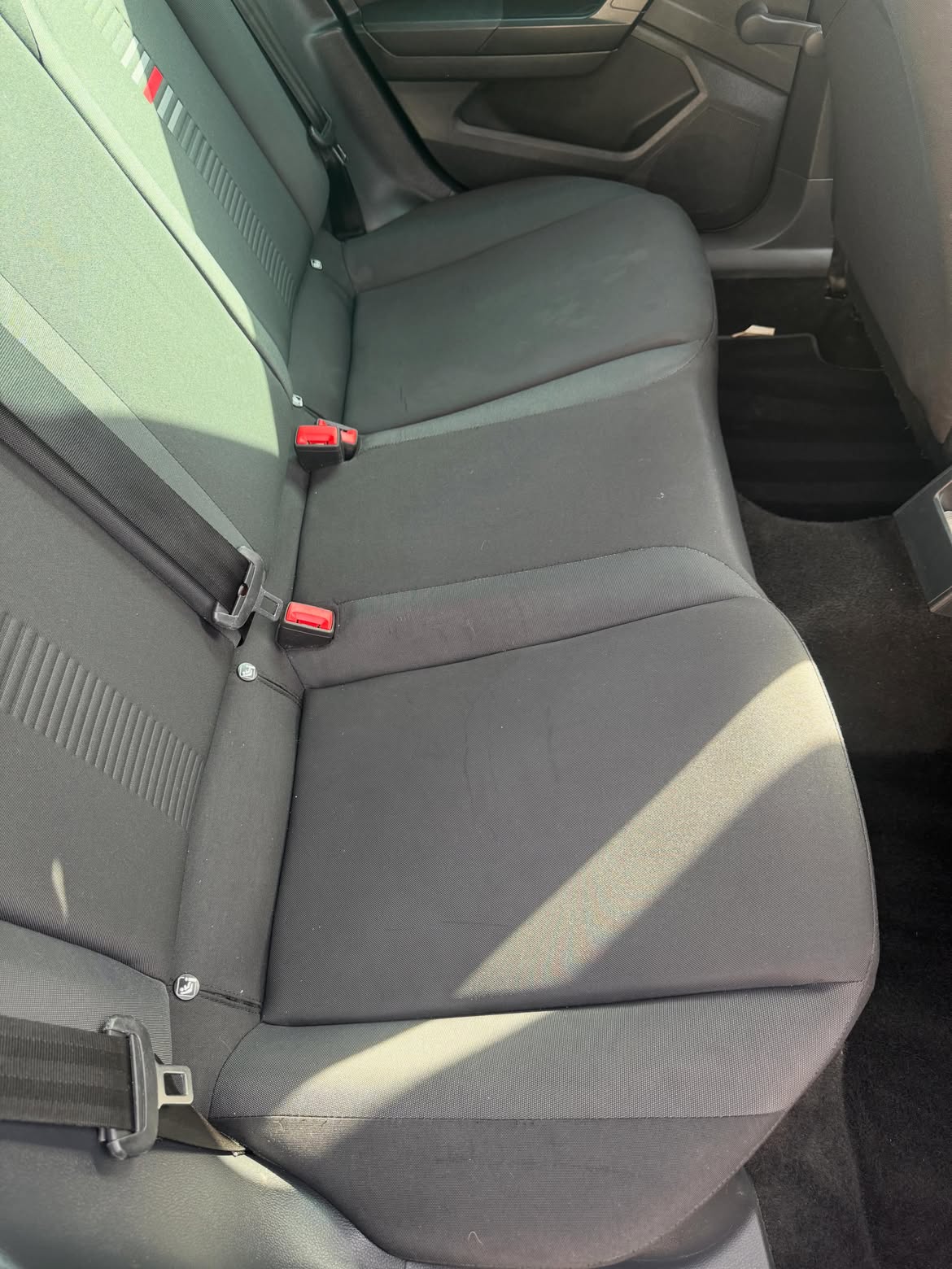 The same rear seat bench after cleaning, fabric even and refreshed
